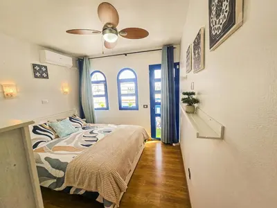 Cama o camas de una habitación en Playmar - Casa Sol dúplex soleado