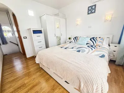 Cama o camas de una habitación en Playmar - Casa Sol dúplex soleado