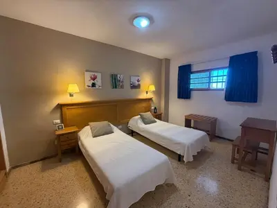 Cama o camas de una habitación en Stay in Gran Canaria, Agaete Parque 310