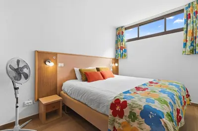 Cama o camas de una habitación en SUNSET BAY 208 by HOMESTAYGRANCANARIA