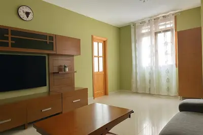 Una televisión o centro de entretenimiento en Vegueta Cool Suites