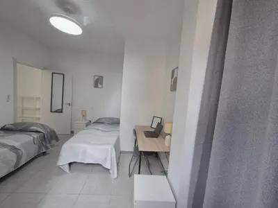 Cama o camas de una habitación en Beach Home - Las Canteras