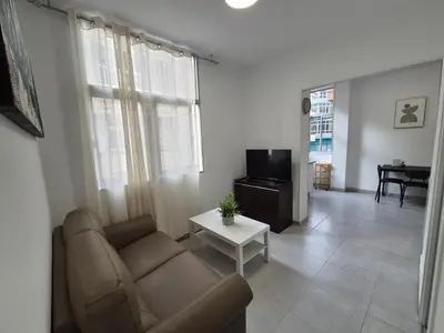 Una televisión o centro de entretenimiento en Beach Home - Las Canteras