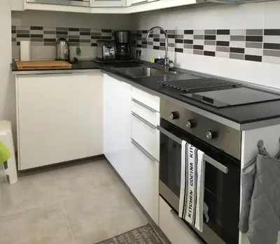 Una cocina o zona de cocina en Mai Apartment