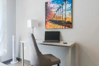 Una televisión o centro de entretenimiento en Home2Book Saucillo Suites, Cozy Stay Las Palmas