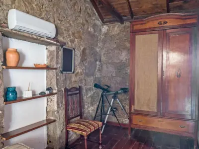 Una televisión o centro de entretenimiento en Casa Rural Pepita - Gran Canaria Center - Tejeda