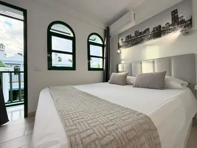 Cama o camas de una habitación en Palms & Pool Dunaflor Verde