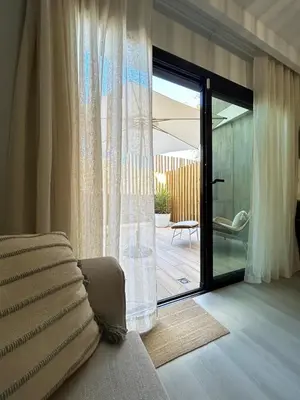 Cama o camas de una habitación en New and cozy apartment next to the beach