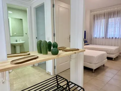Cama o camas de una habitación en Las Canteras Beach by SunHousesCanarias