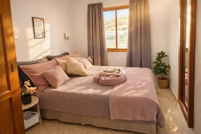 Cama o camas de una habitación en Puerto Feliz Sunset Apartment Sea View with Pool, Terrace, Long Stay 30 Days Special Offer