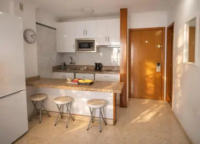Una cocina o zona de cocina en Puerto Feliz Sunset Apartment Sea View with Pool, Terrace, Long Stay 30 Days Special Offer