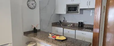 Una cocina o zona de cocina en Puerto Feliz Sunset Apartment Sea View with Pool, Terrace, Long Stay 30 Days Special Offer