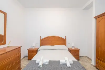 Cama o camas de una habitación en GuestReady - La Suerte cerca Los Alisios