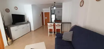 Una televisión o centro de entretenimiento en Alojamiento en Playa de Mogán