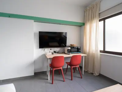 Una televisión o centro de entretenimiento en Apartamento Playa 42