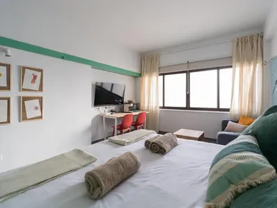 Una televisión o centro de entretenimiento en Apartamento Playa 42