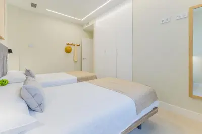 Cama o camas de una habitación en Brisamar Suites IV by VillaGranCanaria