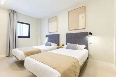 Cama o camas de una habitación en Brisamar Suites IV by VillaGranCanaria