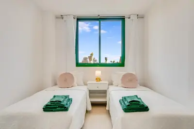Cama o camas de una habitación en Sunny Garden Monte Paraiso