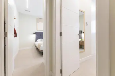 Cama o camas de una habitación en Brisamar Suites by VillaGranCanaria