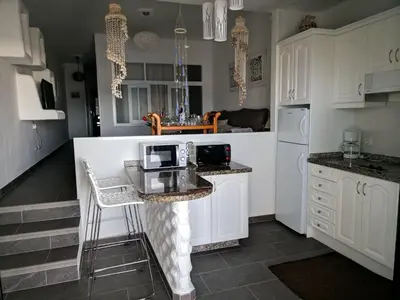Una cocina o zona de cocina en Apartment Wohnung Faro de Sardina mit Blick aufs Wasser by Interhome