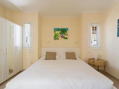 Cama o camas de una habitación en La Gloria Villas San Agustin