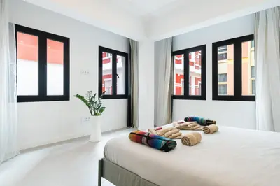 Cama o camas de una habitación en Bright Apt for 4 Las Canteras - Shared Terrace