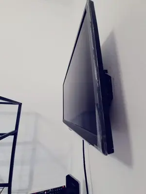 Una televisión o centro de entretenimiento en Se alquila Habitación Doble frente de Playa
