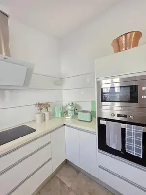 Una cocina o zona de cocina en Faro Quilla 8 PASITO BLANCO Deluxe