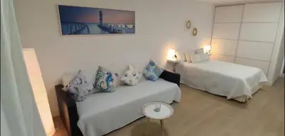 Cama o camas de una habitación en Right on the beach in Las Canteras - First line!