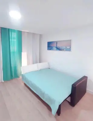 Cama o camas de una habitación en Right on the beach in Las Canteras - First line!