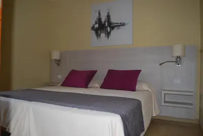 Cama o camas de una habitación en Bungalows Parque Bali con AIRE ACONDICIONADO