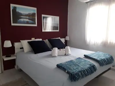Cama o camas de una habitación en Faro de sardina Apartment