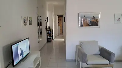 Una televisión o centro de entretenimiento en Faro de sardina Apartment
