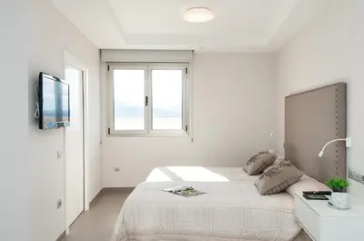 Cama o camas de una habitación en Apartment Las Canteras Nautilus 8D by VillaGranCanaria
