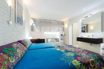 Cama o camas de una habitación en Suites Garden Loft Dalí