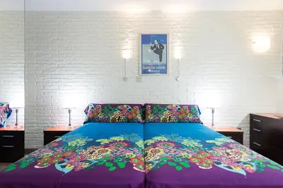 Cama o camas de una habitación en Suites Garden Loft Dalí