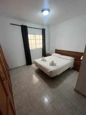 Cama o camas de una habitación en Apartamentos Las Canteras Arena