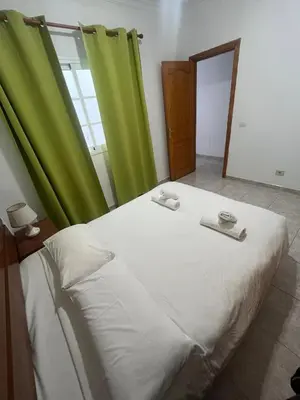 Cama o camas de una habitación en Apartamentos Las Canteras Arena