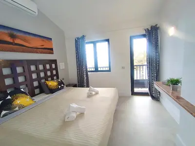 Cama o camas de una habitación en A Dream On The Beach Sun Club