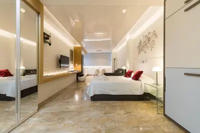 Cama o camas de una habitación en Suites Garden Loft Munch