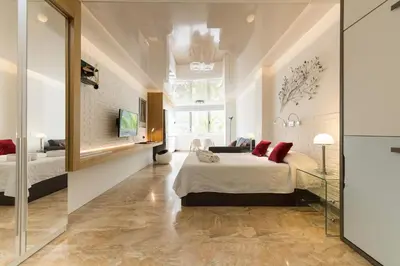 Cama o camas de una habitación en Suites Garden Loft Munch