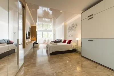 Cama o camas de una habitación en Suites Garden Loft Munch