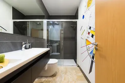 Un baño de Suites Garden Loft Kandinsky