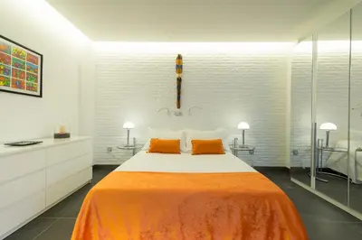 Cama o camas de una habitación en Suites Garden Loft Miro