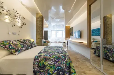 Cama o camas de una habitación en Suites Garden Loft Roy Lichtenstein