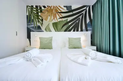 Cama o camas de una habitación en Palm Suites