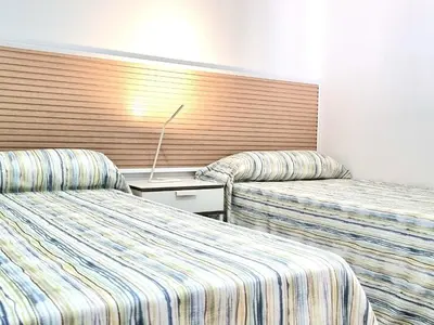 Cama o camas de una habitación en Bungalows Teresa
