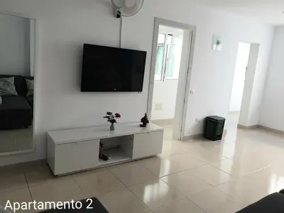 Una televisión o centro de entretenimiento en Apartamento Kings Vegueta