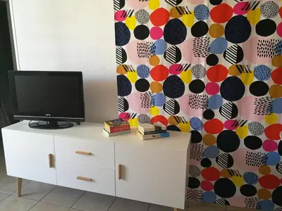 Una televisión o centro de entretenimiento en HUELLA CANARIA Complejo LAS OLAS